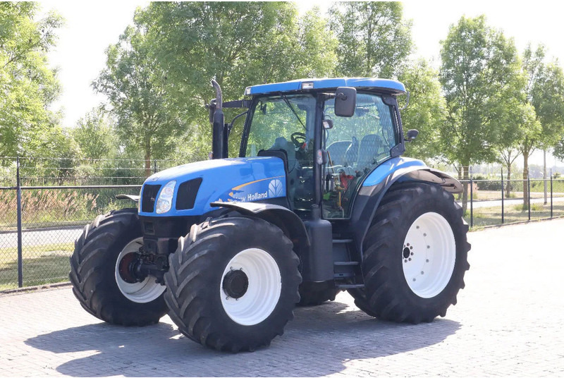 New Holland TS135A | 40 KM/H | 4X4 | SUPERSTEER - Máy cày: hình 1 New Holland TS135A | 40 KM/H | 4X4 | SUPERSTEER - Máy cày: hình 1