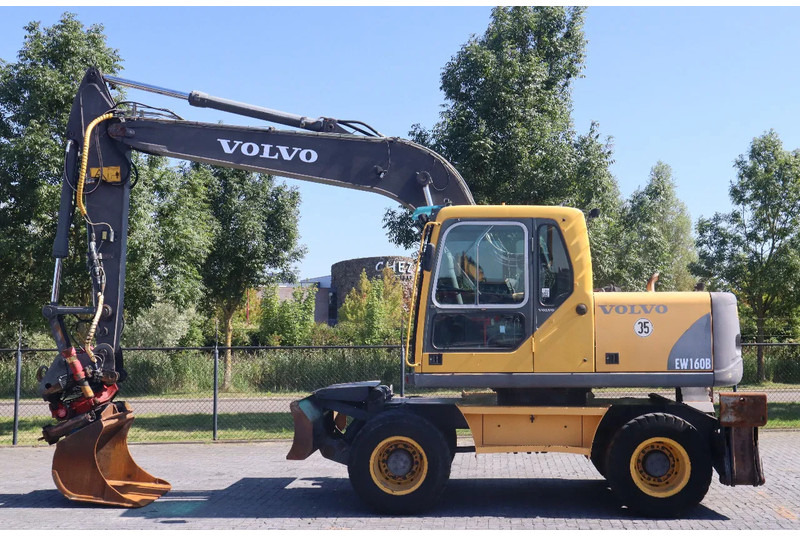 Volvo EW160B | EW 160 B | TILT ROTATOR | BUCKET | OUTRIGGERS | BLADE - Máy xúc bánh lốp: hình 1 Volvo EW160B | EW 160 B | TILT ROTATOR | BUCKET | OUTRIGGERS | BLADE - Máy xúc bánh lốp: hình 1