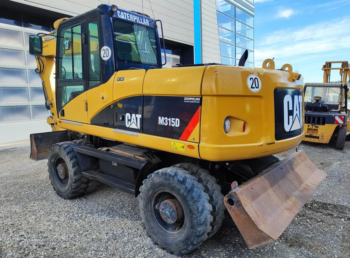 Caterpillar M315D - Máy xúc bánh lốp: hình 1 Caterpillar M315D - Máy xúc bánh lốp: hình 1