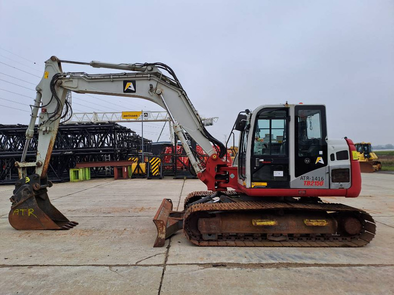 Takeuchi TB2150 - Máy xúc bánh xích: hình 1 Takeuchi TB2150 - Máy xúc bánh xích: hình 1
