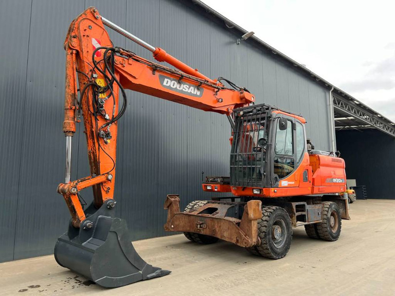 Doosan DX210W - Máy xúc bánh lốp: hình 1 Doosan DX210W - Máy xúc bánh lốp: hình 1