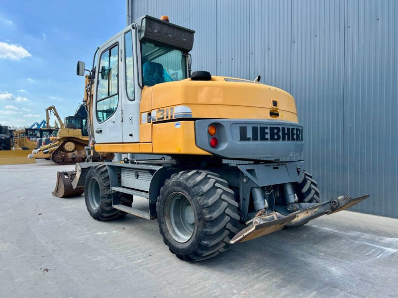 Liebherr A 311 Litronic - Máy xúc bánh lốp: hình 2 Liebherr A 311 Litronic - Máy xúc bánh lốp: hình 2
