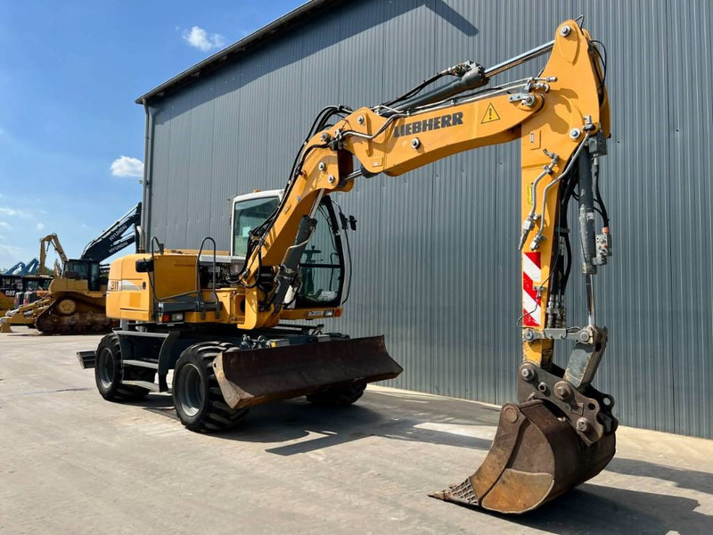 Liebherr A311 Litronic - Máy xúc bánh lốp: hình 3 Liebherr A311 Litronic - Máy xúc bánh lốp: hình 3