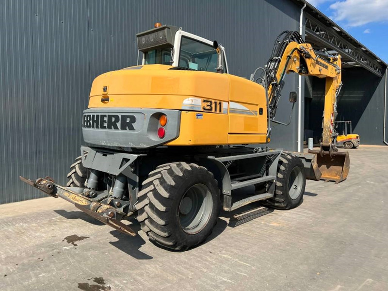 Liebherr A311 Litronic - Máy xúc bánh lốp: hình 4 Liebherr A311 Litronic - Máy xúc bánh lốp: hình 4