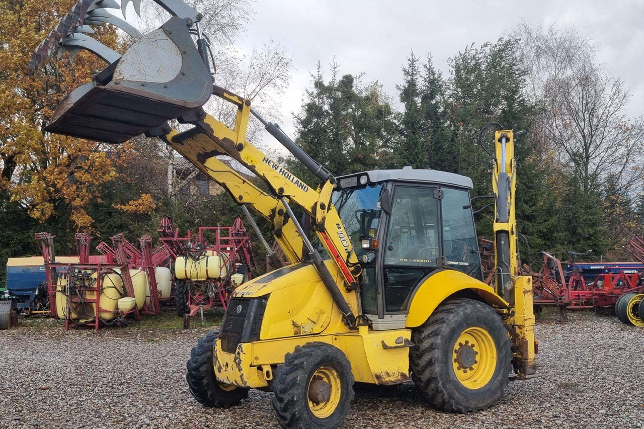 New Holland B110B - Máy xúc trước múc sau: hình 1 New Holland B110B - Máy xúc trước múc sau: hình 1