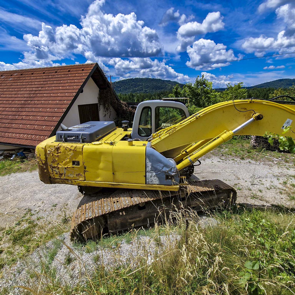 New Holland Kobelco E215 - Máy xúc bánh xích: hình 4 New Holland Kobelco E215 - Máy xúc bánh xích: hình 4