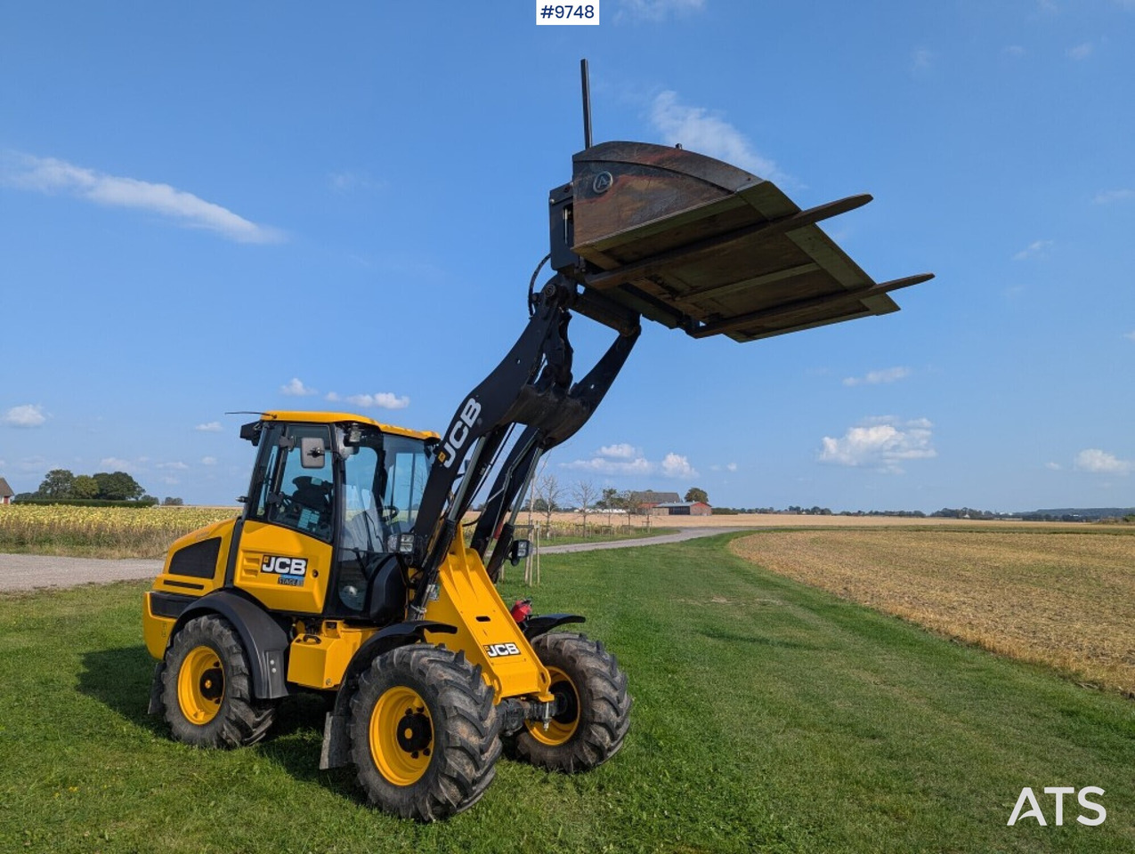 Wheel loader JCB 409 Stage V Nordic Edition 40km/h with attachments - Máy xúc lật bánh lốp: hình 2 Wheel loader JCB 409 Stage V Nordic Edition 40km/h with attachments - Máy xúc lật bánh lốp: hình 2
