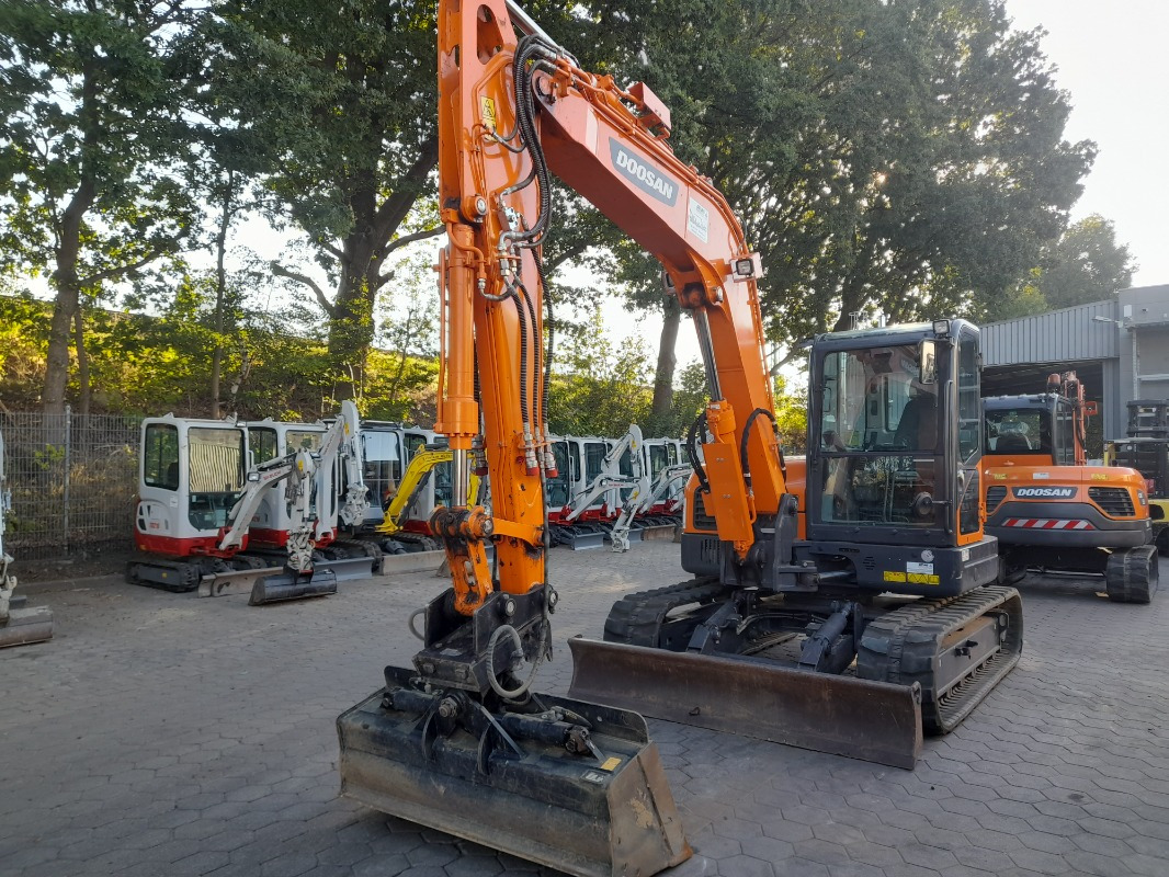 Doosan DX85R-3 - Máy xúc: hình 1 Doosan DX85R-3 - Máy xúc: hình 1