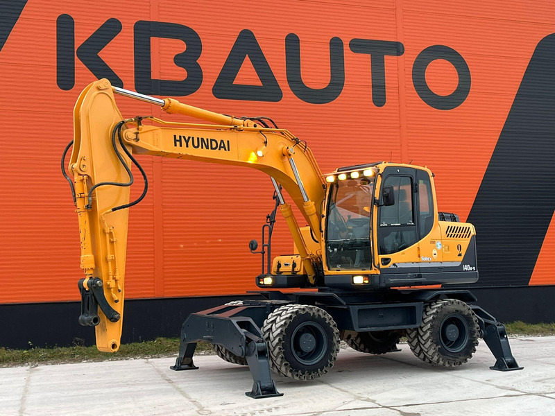 Hyundai R 140 W-9 AC - Máy xúc bánh lốp: hình 1 Hyundai R 140 W-9 AC - Máy xúc bánh lốp: hình 1