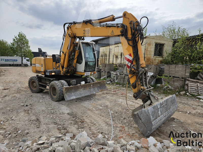 Liebherr A 316 Litronic - Máy xúc bánh lốp: hình 2 Liebherr A 316 Litronic - Máy xúc bánh lốp: hình 2