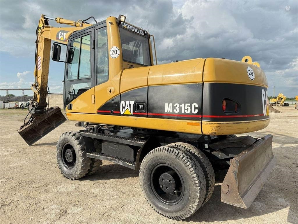 CAT M315C - Máy xúc bánh lốp: hình 1 CAT M315C - Máy xúc bánh lốp: hình 1