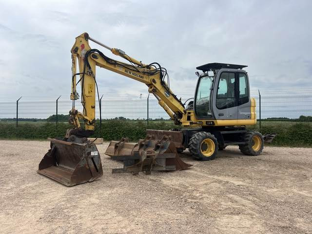 New Holland MH2.6 - Máy xúc bánh lốp: hình 1 New Holland MH2.6 - Máy xúc bánh lốp: hình 1