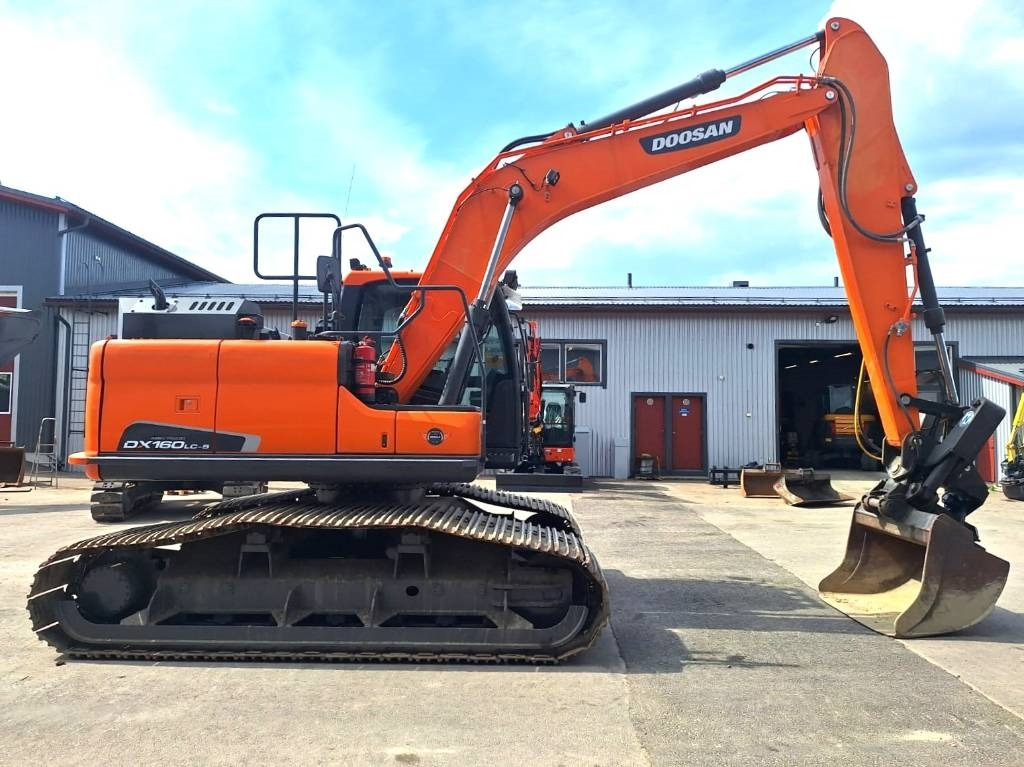 Doosan DX160LCH-5 METSÄMALLI KALLISTAJALLA - Máy xúc bánh xích: hình 5 Doosan DX160LCH-5 METSÄMALLI KALLISTAJALLA - Máy xúc bánh xích: hình 5