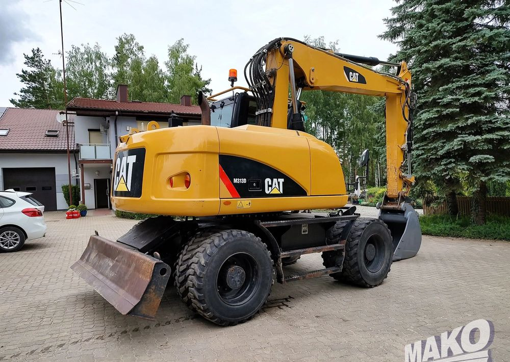 Caterpillar M313D - Máy xúc bánh lốp: hình 4 Caterpillar M313D - Máy xúc bánh lốp: hình 4