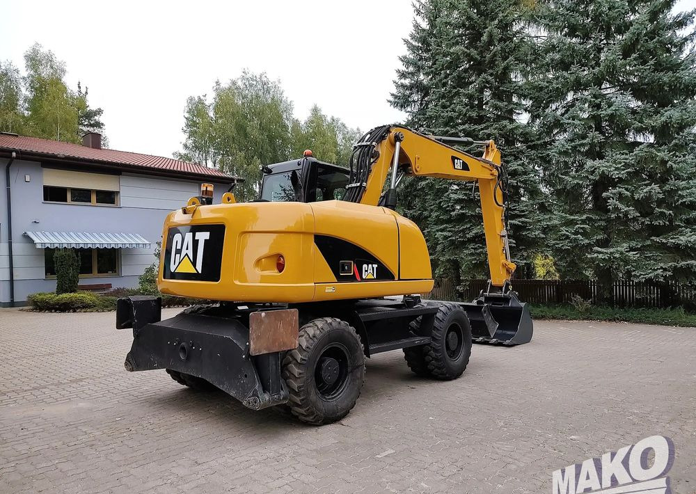 Caterpillar M313D - Máy xúc bánh lốp: hình 4 Caterpillar M313D - Máy xúc bánh lốp: hình 4