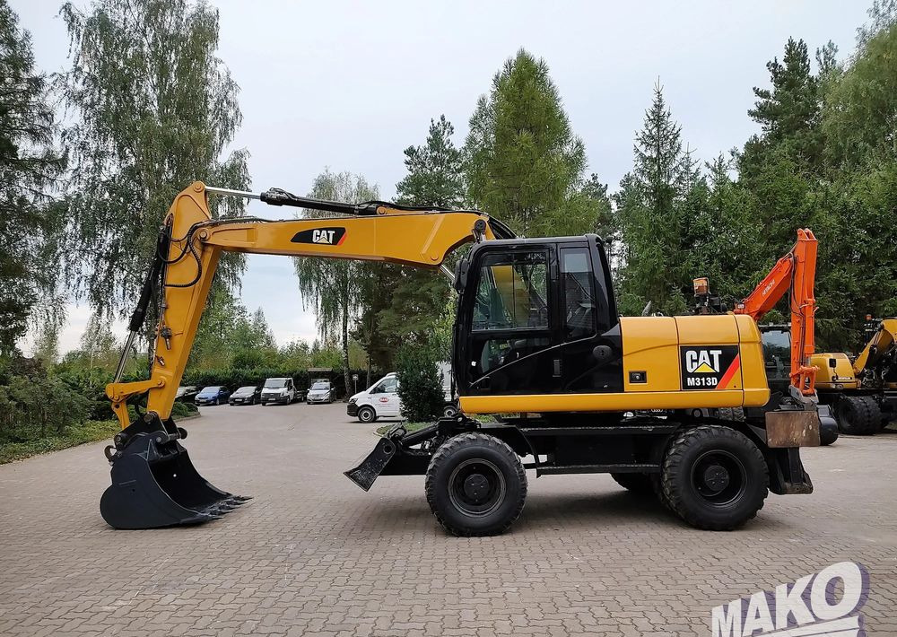 Caterpillar M313D - Máy xúc bánh lốp: hình 1 Caterpillar M313D - Máy xúc bánh lốp: hình 1