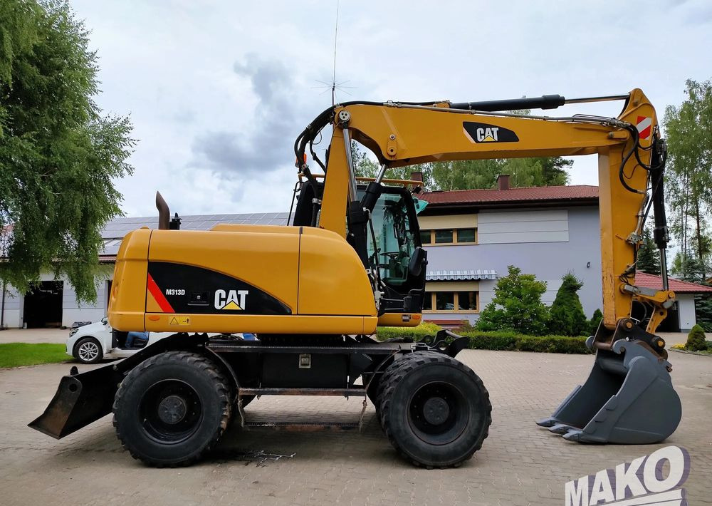 Caterpillar M313D - Máy xúc bánh lốp: hình 5 Caterpillar M313D - Máy xúc bánh lốp: hình 5