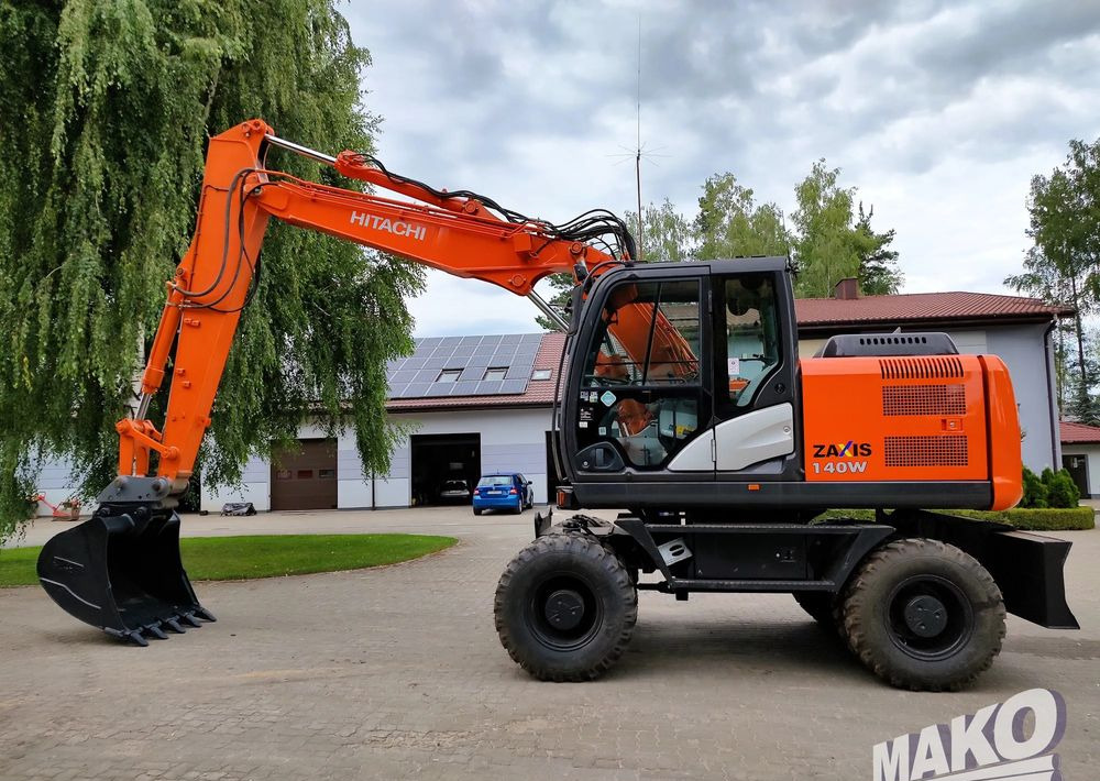 Hitachi ZX 140 - Máy xúc bánh lốp: hình 1 Hitachi ZX 140 - Máy xúc bánh lốp: hình 1