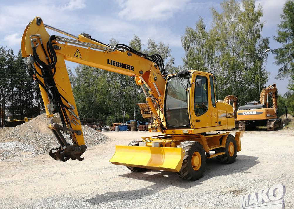 Liebherr A 314 Litronic - Máy xúc bánh lốp: hình 1 Liebherr A 314 Litronic - Máy xúc bánh lốp: hình 1