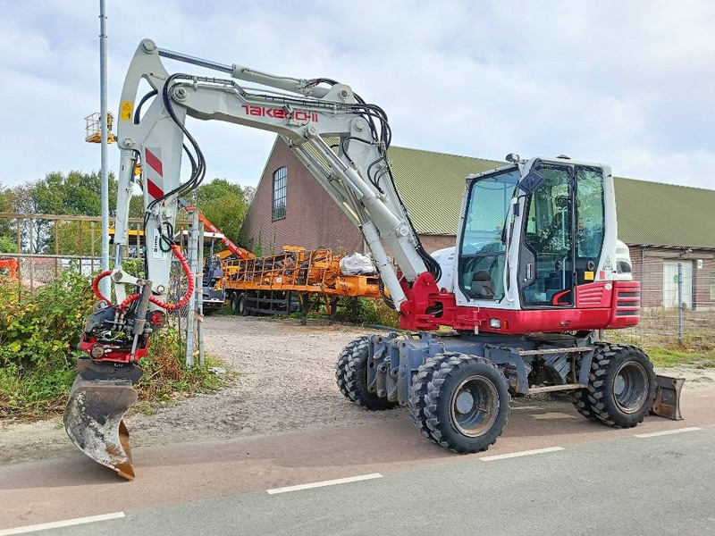 Takeuchi TB 295 W mobiele graafmachine mobile excavator - Máy xúc bánh lốp: hình 1 Takeuchi TB 295 W mobiele graafmachine mobile excavator - Máy xúc bánh lốp: hình 1