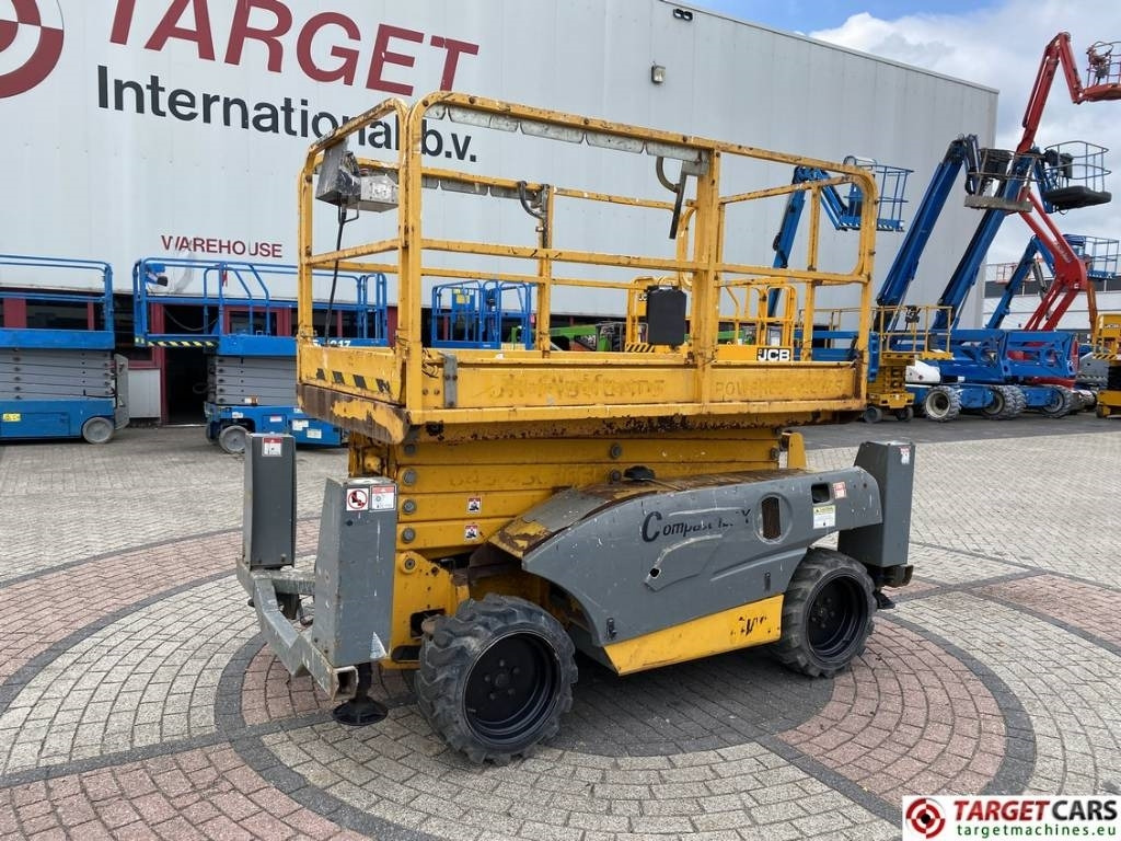 Haulotte Compact 12DX Diesel 4x4 Scissor Work Lift 1206cm - Máy nâng người hình kéo: hình 1 Haulotte Compact 12DX Diesel 4x4 Scissor Work Lift 1206cm - Máy nâng người hình kéo: hình 1