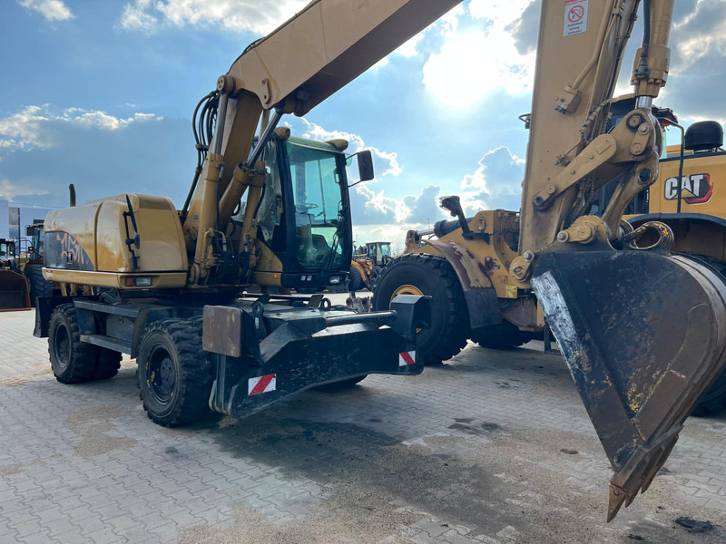 Caterpillar M318C - Máy xúc: hình 2 Caterpillar M318C - Máy xúc: hình 2