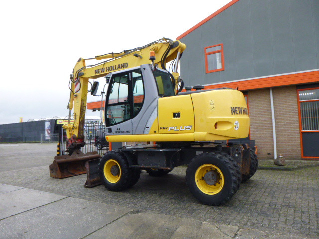 NEW HOLLAND MH PLUS - Máy xúc bánh lốp: hình 3 NEW HOLLAND MH PLUS - Máy xúc bánh lốp: hình 3