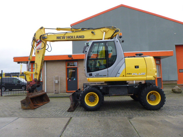 NEW HOLLAND MH PLUS - Máy xúc bánh lốp: hình 2 NEW HOLLAND MH PLUS - Máy xúc bánh lốp: hình 2