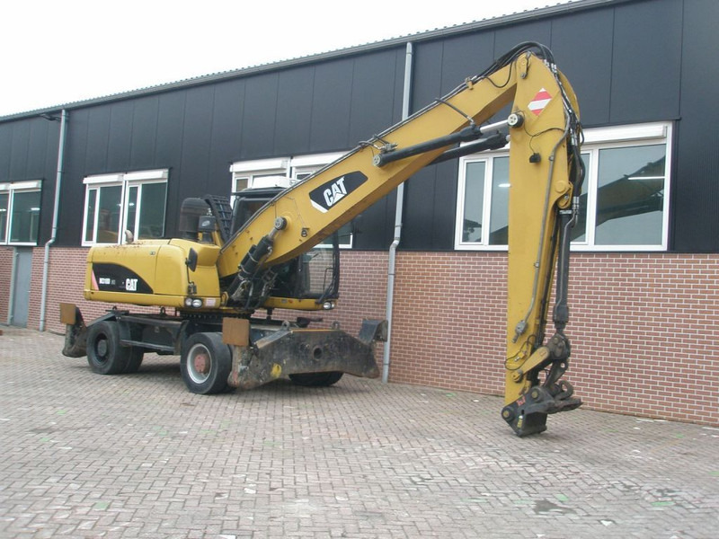 Caterpillar M318D - Máy xúc bánh lốp: hình 3 Caterpillar M318D - Máy xúc bánh lốp: hình 3