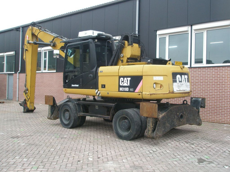 Caterpillar M318D - Máy xúc bánh lốp: hình 2 Caterpillar M318D - Máy xúc bánh lốp: hình 2