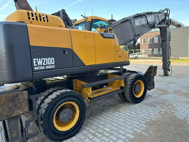 Máy cạp rác/ Công nghiệp Volvo EW210D MH: hình 16 Máy cạp rác/ Công nghiệp Volvo EW210D MH: hình 16
