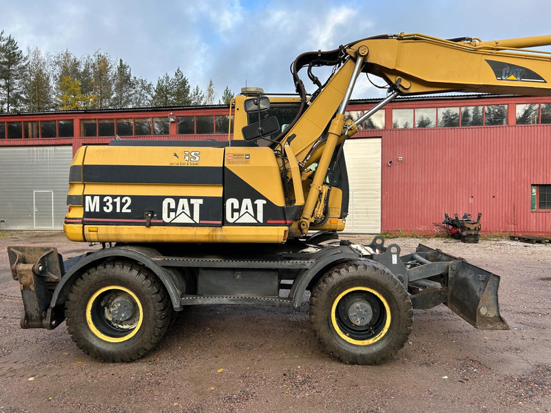 Caterpillar M312 Engcon EC20 tiltrotator - Máy xúc bánh lốp: hình 5 Caterpillar M312 Engcon EC20 tiltrotator - Máy xúc bánh lốp: hình 5