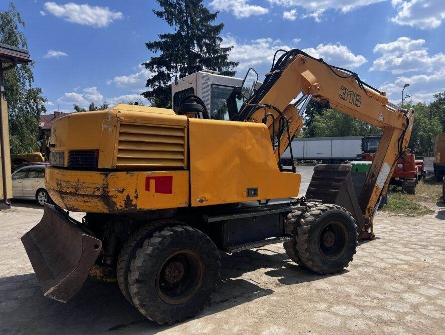 Liebherr A316 - Máy xúc bánh lốp: hình 5 Liebherr A316 - Máy xúc bánh lốp: hình 5
