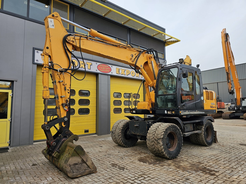 Hyundai R140W-7A - Máy xúc bánh lốp: hình 2 Hyundai R140W-7A - Máy xúc bánh lốp: hình 2