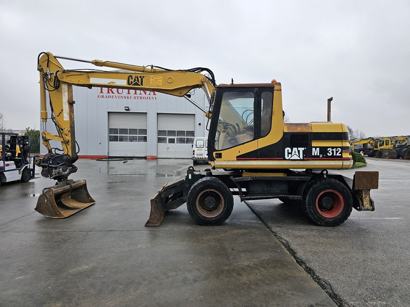CATERPILLAR M312D - Máy xúc bánh lốp: hình 1 CATERPILLAR M312D - Máy xúc bánh lốp: hình 1