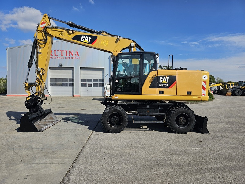 CATERPILLAR M320F - Máy xúc bánh lốp: hình 1 CATERPILLAR M320F - Máy xúc bánh lốp: hình 1