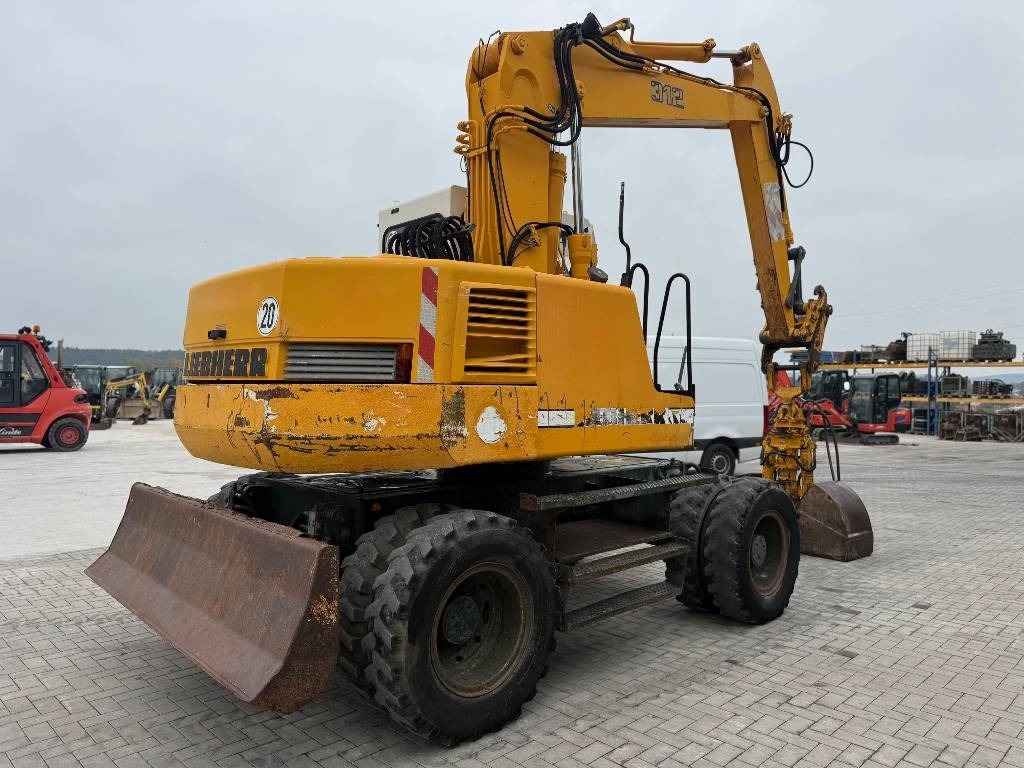 Liebherr A 312 - Máy xúc bánh lốp: hình 5 Liebherr A 312 - Máy xúc bánh lốp: hình 5