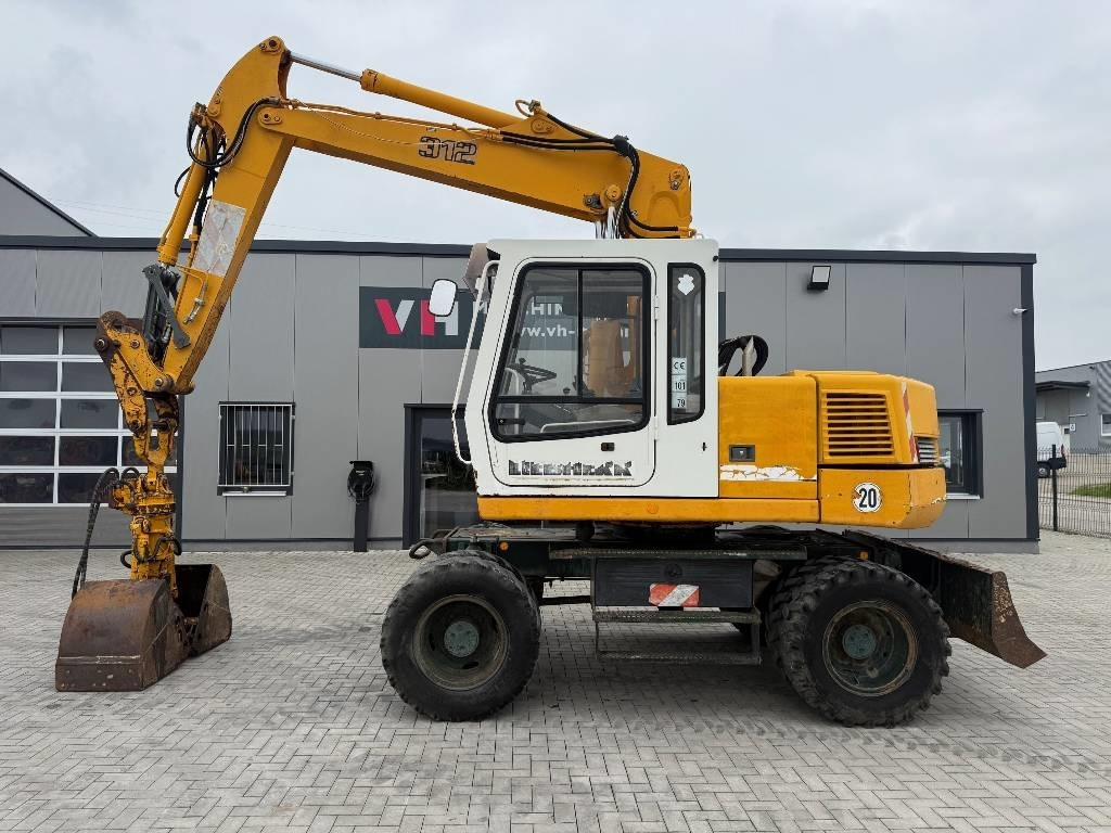 Liebherr A 312 - Máy xúc bánh lốp: hình 2 Liebherr A 312 - Máy xúc bánh lốp: hình 2