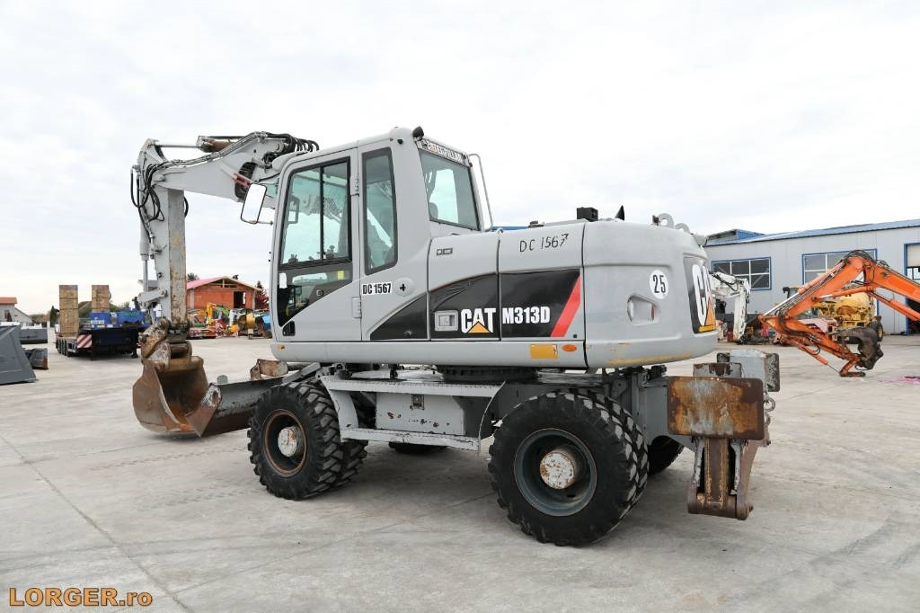 CAT M 313 D - Máy xúc bánh lốp: hình 2 CAT M 313 D - Máy xúc bánh lốp: hình 2