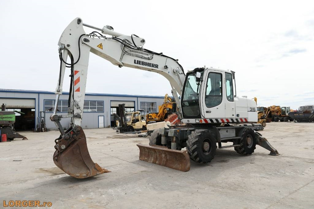 Liebherr A 316 Litronic - Máy xúc bánh lốp: hình 5 Liebherr A 316 Litronic - Máy xúc bánh lốp: hình 5