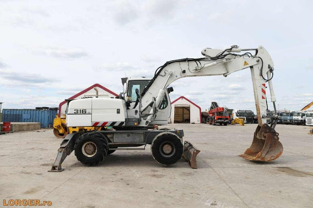 Liebherr A 316 Litronic - Máy xúc bánh lốp: hình 1 Liebherr A 316 Litronic - Máy xúc bánh lốp: hình 1
