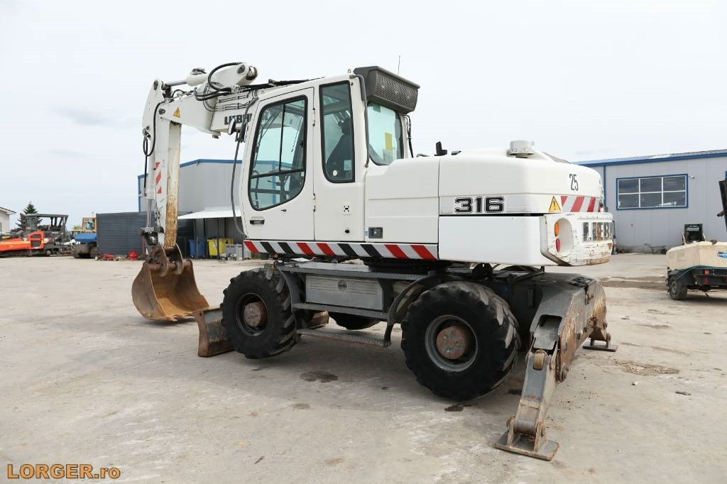 Liebherr A 316 Litronic - Máy xúc bánh lốp: hình 3 Liebherr A 316 Litronic - Máy xúc bánh lốp: hình 3
