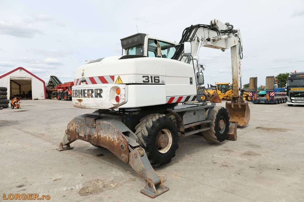 Liebherr A 316 Litronic - Máy xúc bánh lốp: hình 2 Liebherr A 316 Litronic - Máy xúc bánh lốp: hình 2