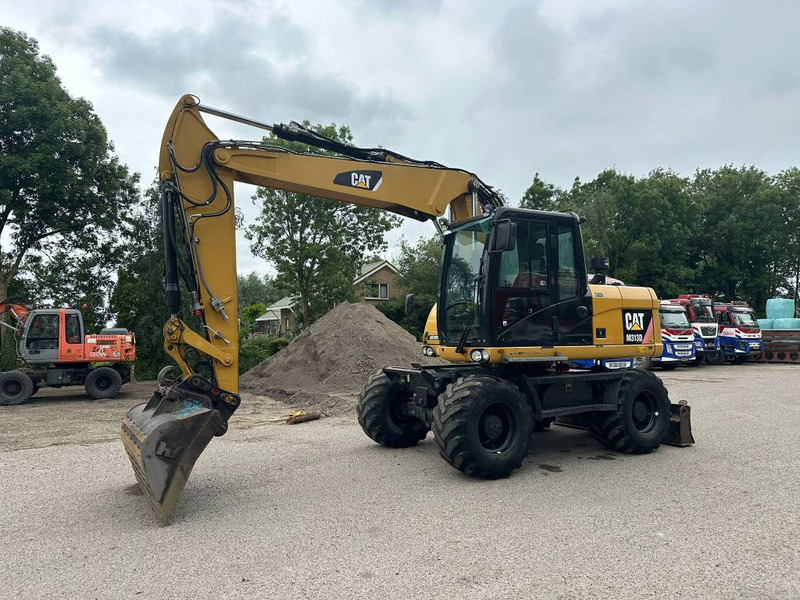 Cat M 313 D - Máy xúc bánh lốp: hình 2 Cat M 313 D - Máy xúc bánh lốp: hình 2