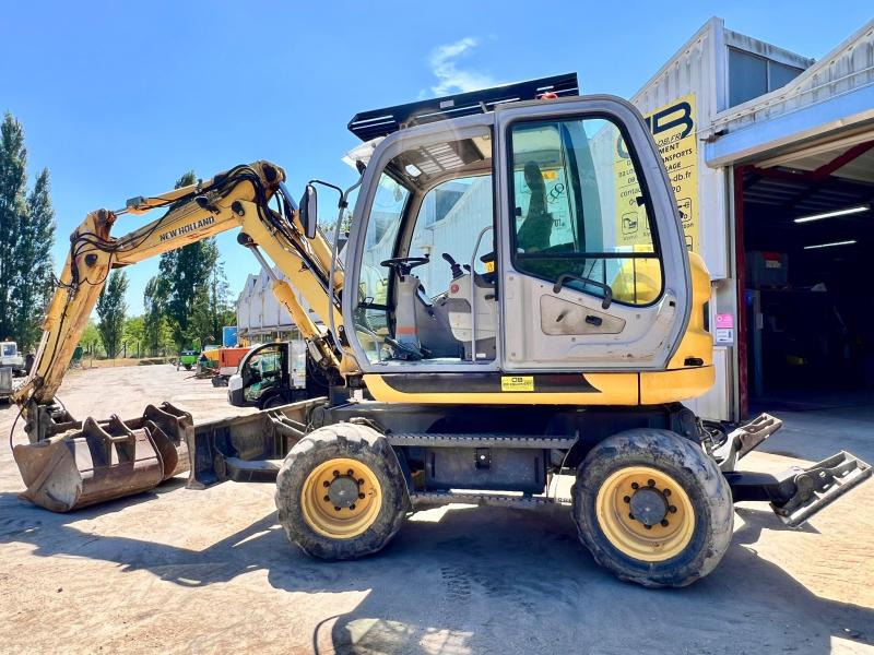 New Holland MH 2.6 PELLE A PNEUS 10T - Máy xúc bánh lốp: hình 2 New Holland MH 2.6 PELLE A PNEUS 10T - Máy xúc bánh lốp: hình 2