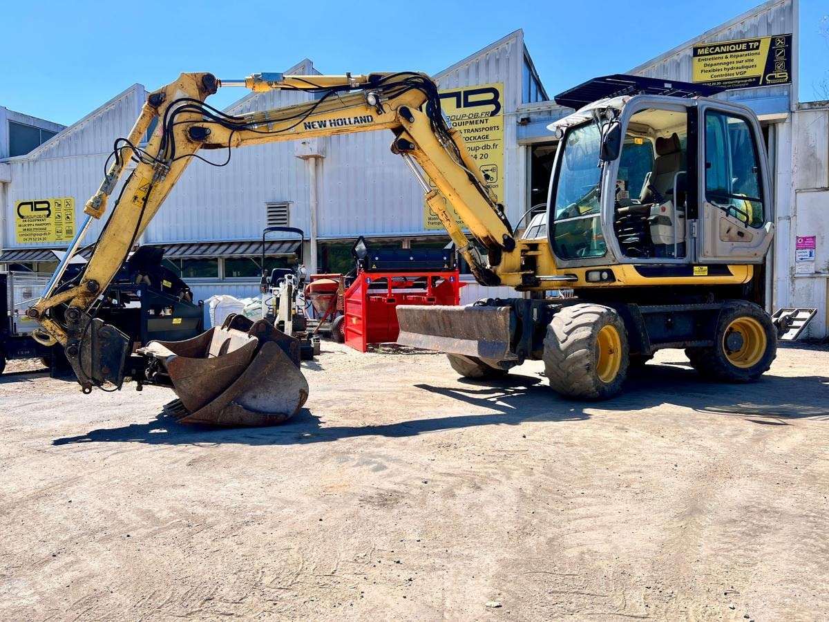 New Holland MH 2.6 PELLE A PNEUS 10T - Máy xúc bánh lốp: hình 1 New Holland MH 2.6 PELLE A PNEUS 10T - Máy xúc bánh lốp: hình 1