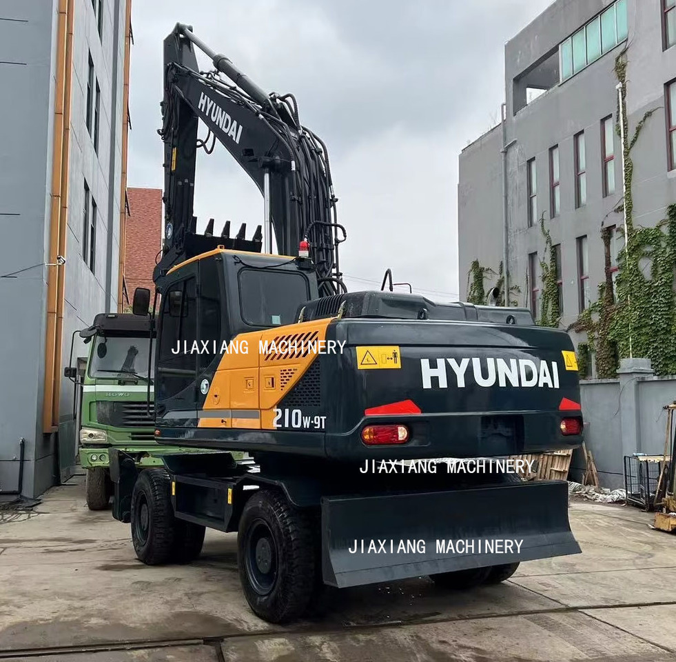 Hyundai 210w-9 wheel excavator - Máy xúc bánh lốp: hình 4 Hyundai 210w-9 wheel excavator - Máy xúc bánh lốp: hình 4