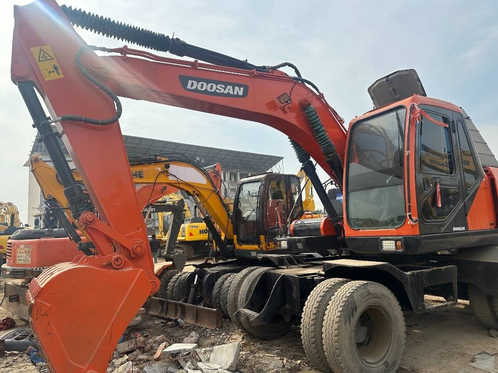 Doosan DX 150W -9 - Máy xúc bánh lốp: hình 5 Doosan DX 150W -9 - Máy xúc bánh lốp: hình 5