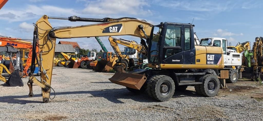 CAT M 315 D - Máy xúc bánh lốp: hình 1 CAT M 315 D - Máy xúc bánh lốp: hình 1