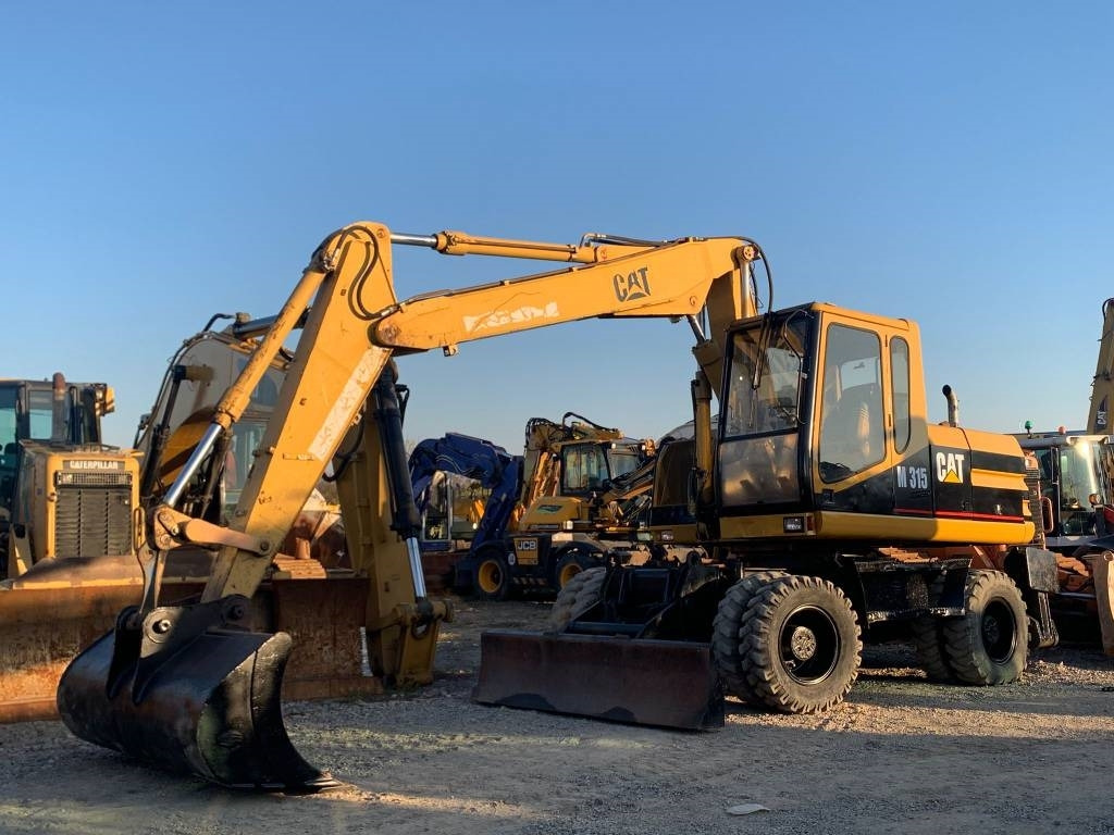 CAT M 315 - Máy xúc bánh lốp: hình 2 CAT M 315 - Máy xúc bánh lốp: hình 2